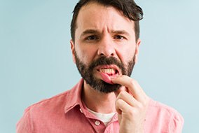 A closeup of a young man with gingivitis