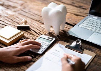 A patient calculating their dental insurance benefits