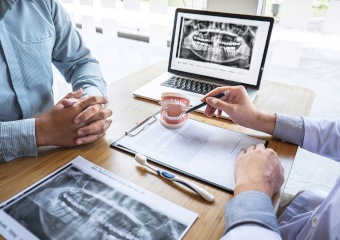 a dentist consulting with a patient